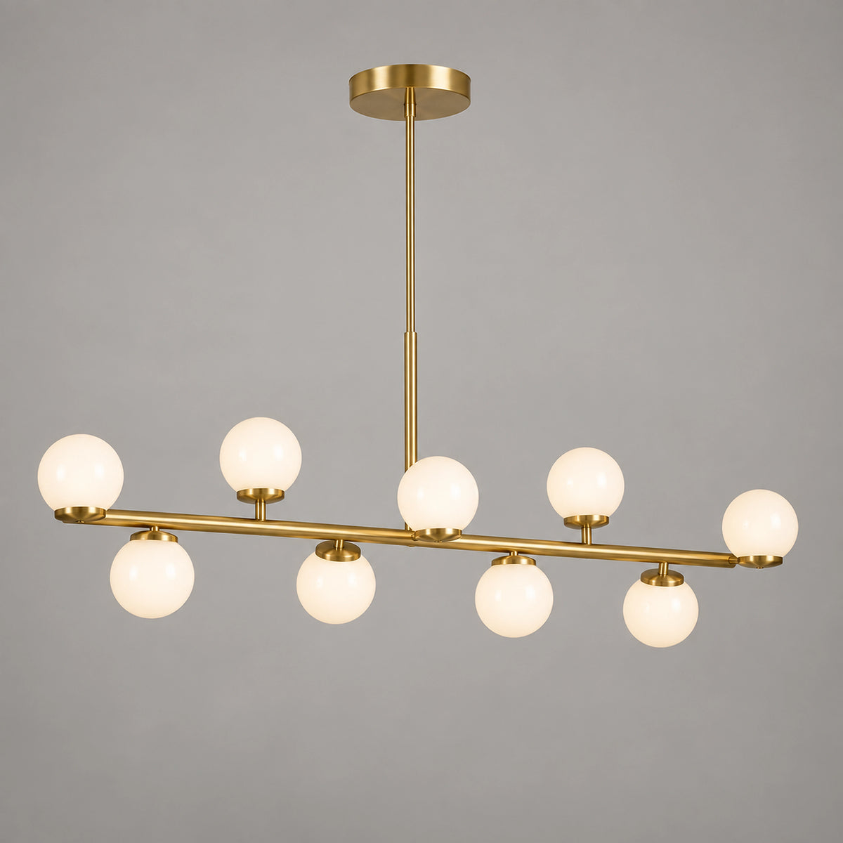 Suspension linéaire dorée à 9 globes opalins