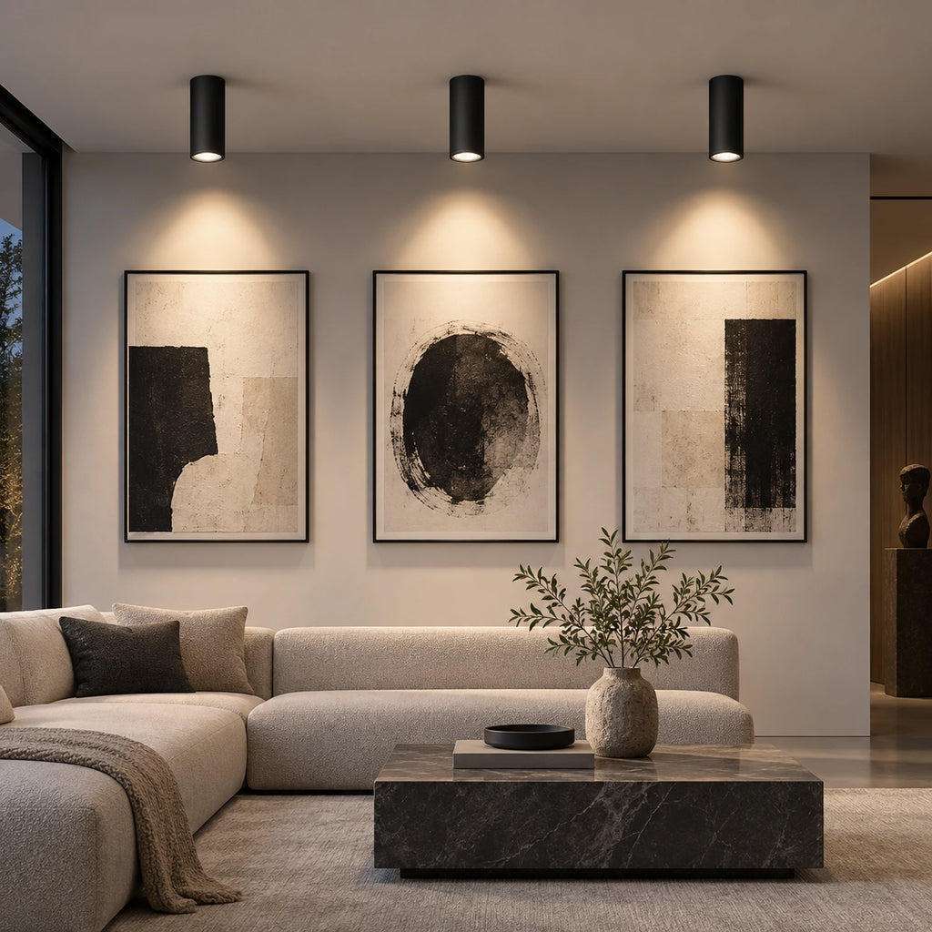 Spots LED cylindriques noirs dans un salon