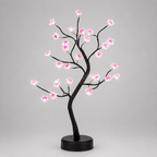 Lampe arbre fleur de cerisier LED allumée, vue de trois quarts avec sa base ronde