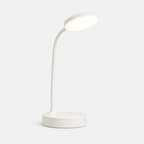 Lampe LED blanche à bras flexible et base ronde, éteinte, sur fond gris neutre.