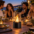 Cheminée de table noire utilisée pendant un dîner en terrasse